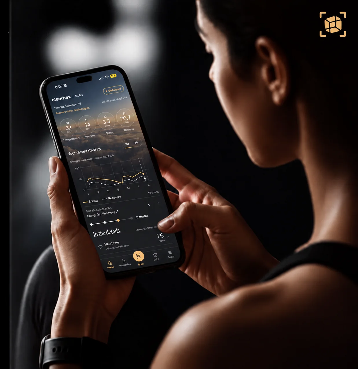 A client holding a phone showing the GetClear home screen.