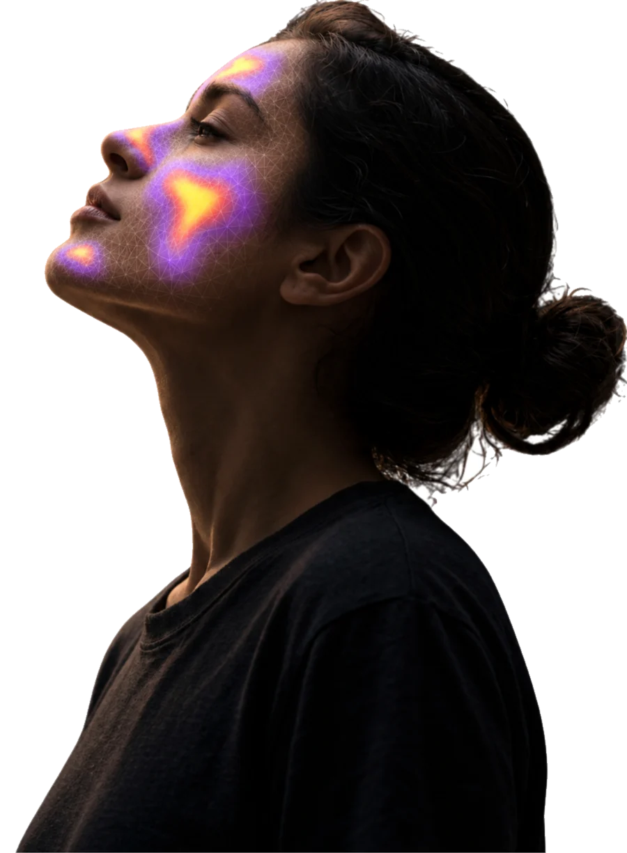 A person in profile, a scan mesh reading across the cheek and brow.